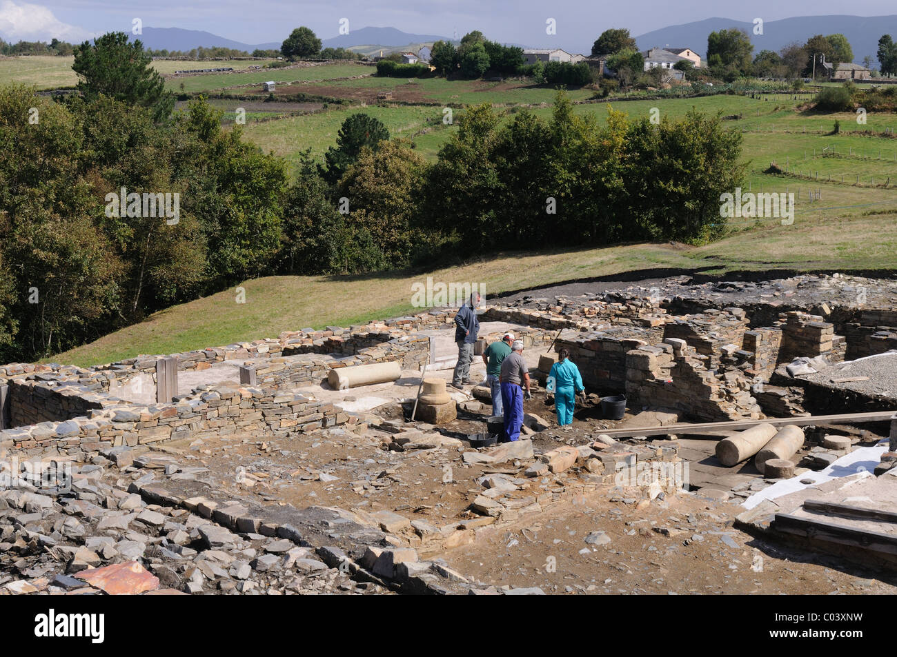 Working in the patio of the " Domus " Archaeological site " Chao Samartin " Asturias SPAIN Stock Photo