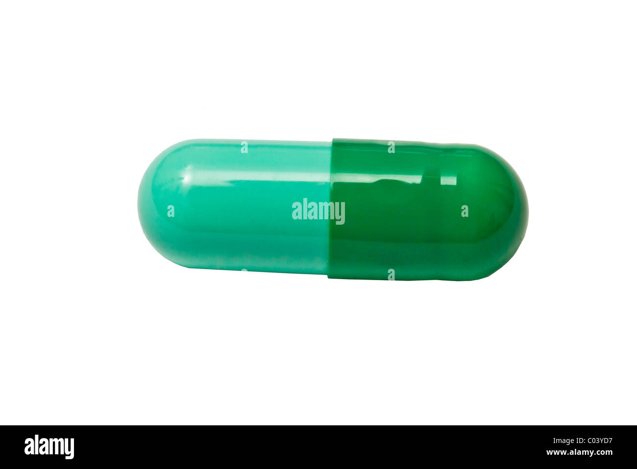 Green capsule isolated on white background Stock Photo Alamy