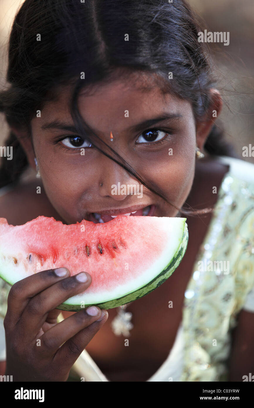 Indian girl eating a slice watermelon Andhra Pradesh South India Stock ...