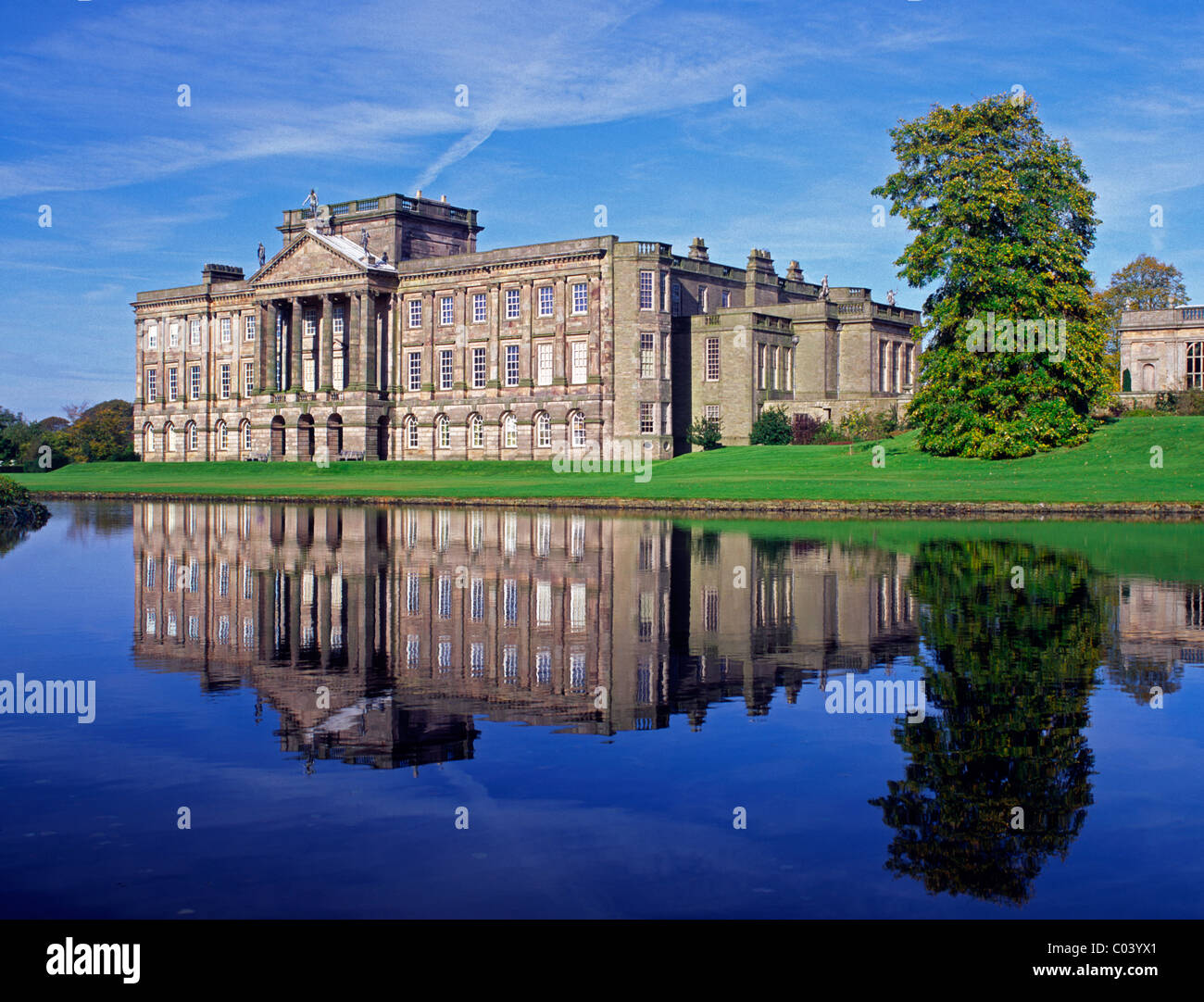 England, Cheshire, Lyme Park, Lyme Hall reflected in lake Stock Photo