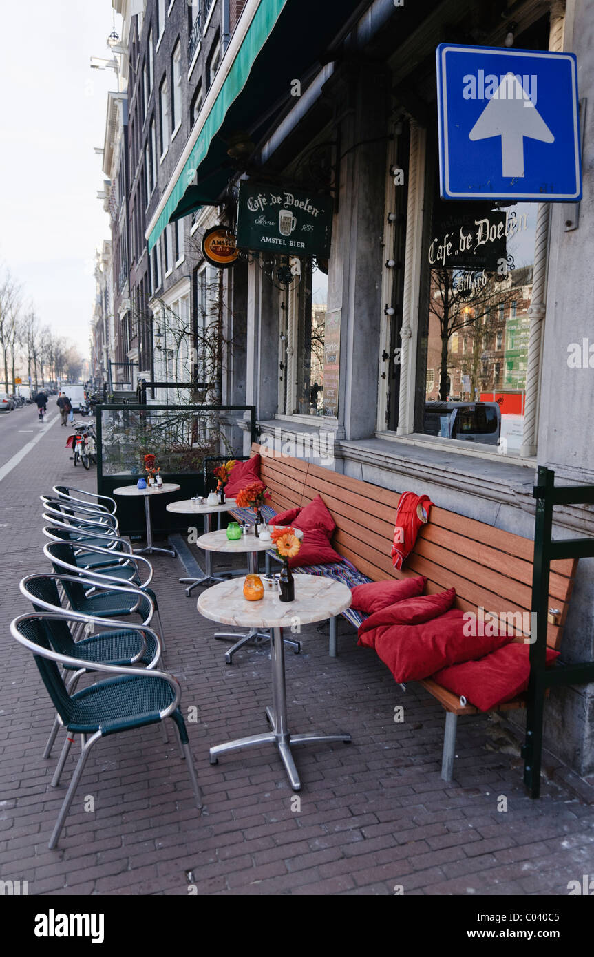Al-fresco tables and chairs on a footpath outside a Dutch pub Stock Photo
