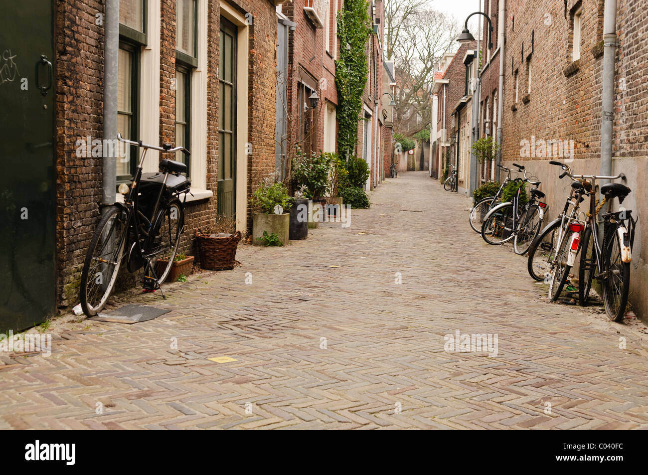 Bicycles parked on a quaint Dutch street in The Netherlands Stock Photo ...