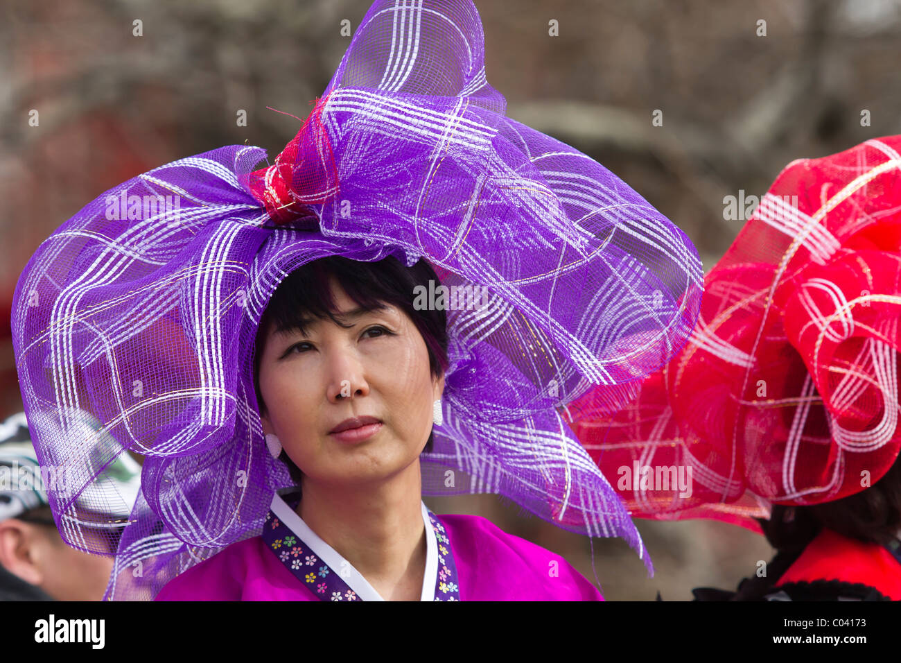 Korean woman in purple headdress riding on a float in the 2011 Lunar ...