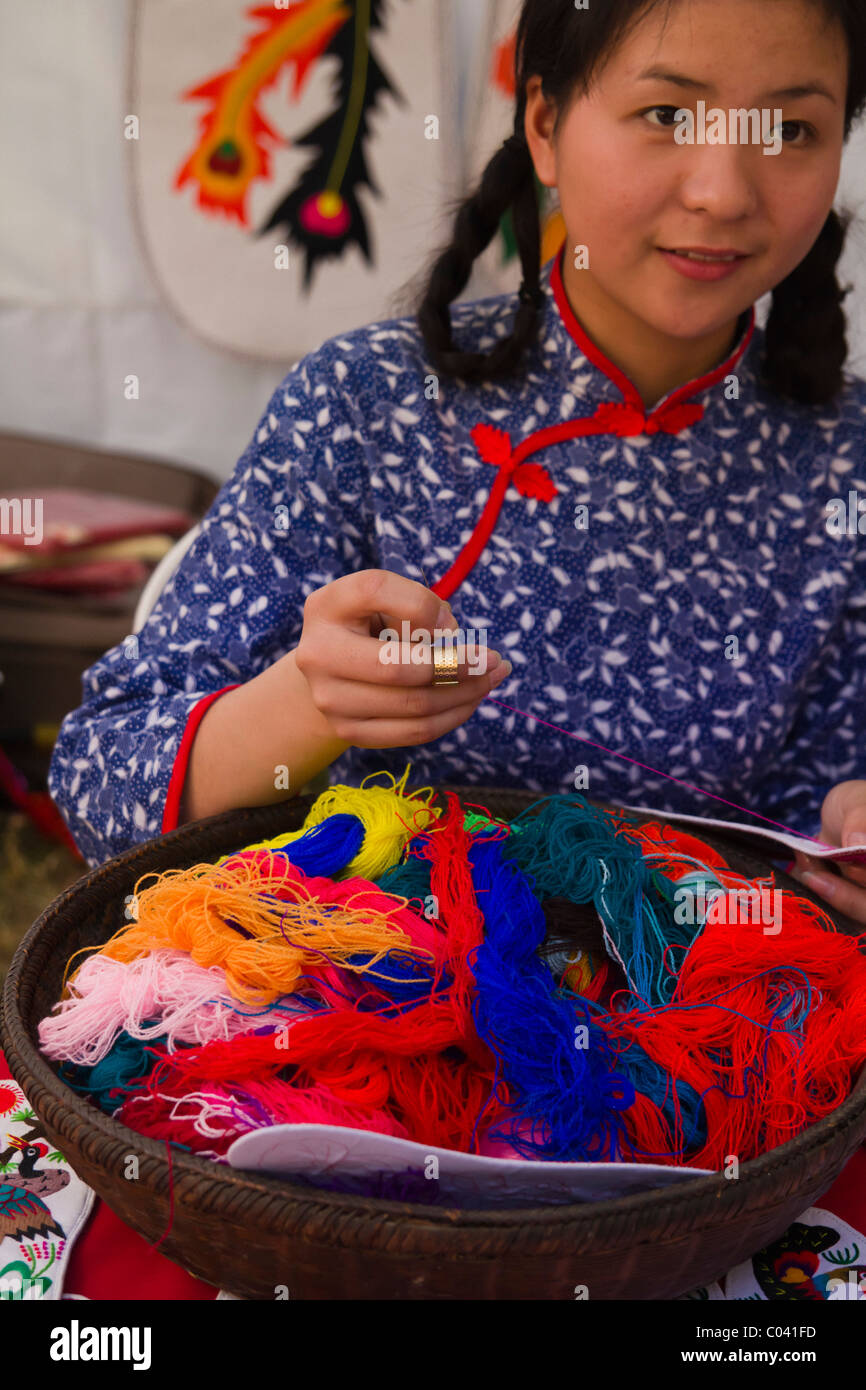 a beautiful Chinese lady knitting a traditional handicraft Stock Photo