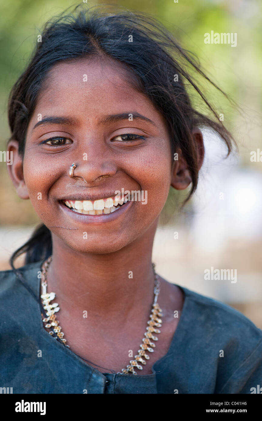 Happy young poor lower caste Indian street teenage girl smiling. Andhra Pradesh, India Stock Photo