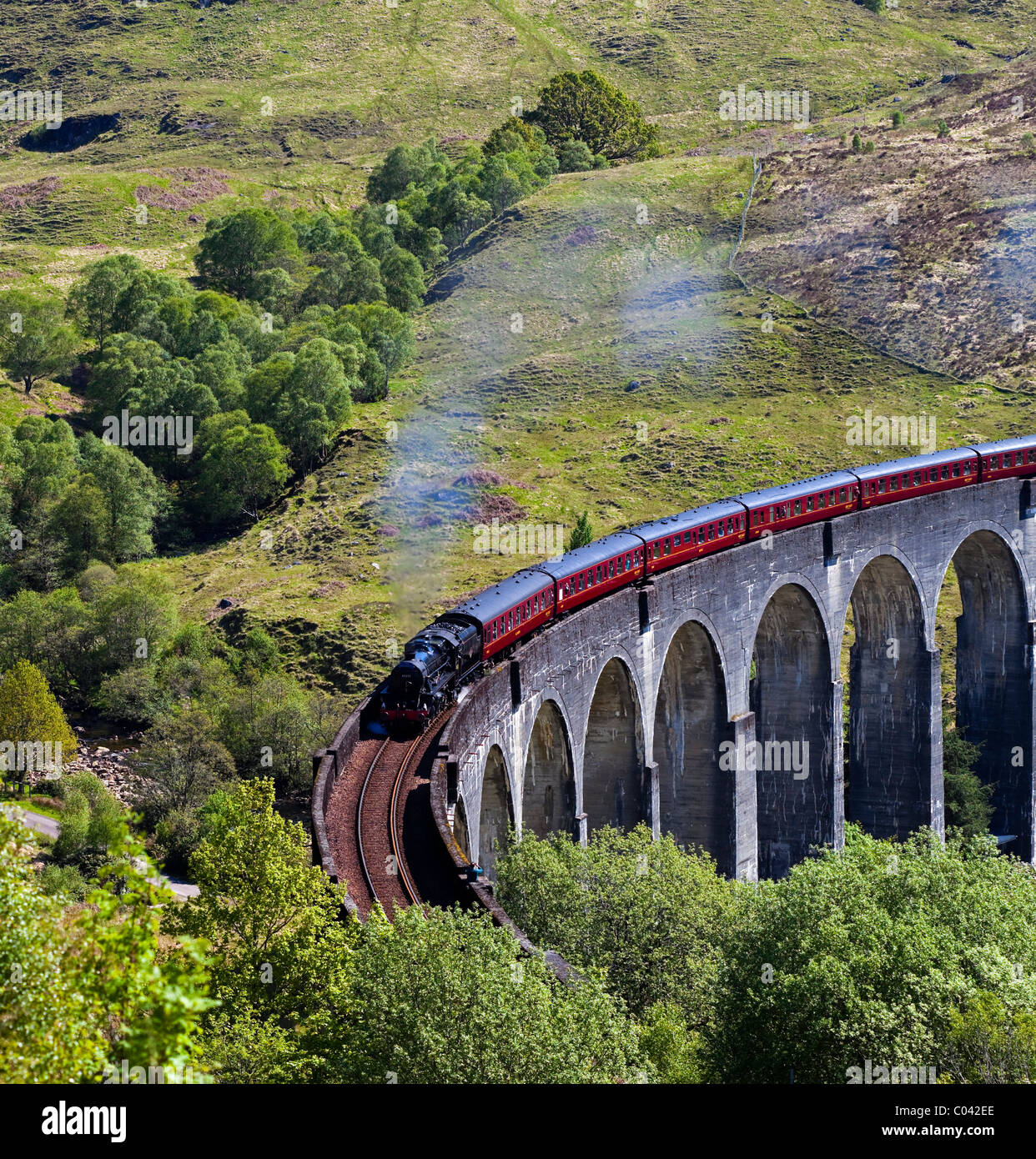 Jacobite Steam Train crossing Glenfinnan Viaduct Lochaber, Scotland UK Europe Stock Photo