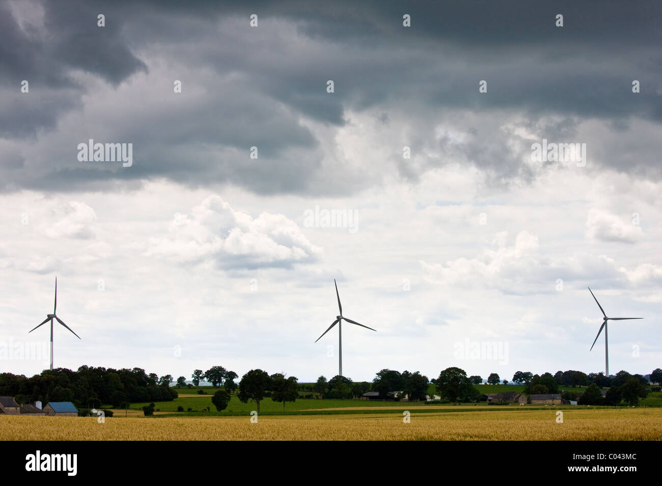 Wind turbines for wind power in meadow in rural Normandy, France Stock Photo