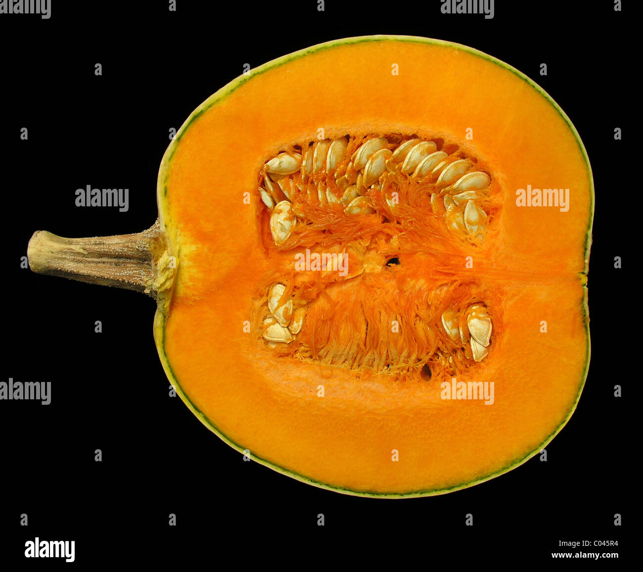 Ripe bisected pumpkin isolated on black Stock Photo