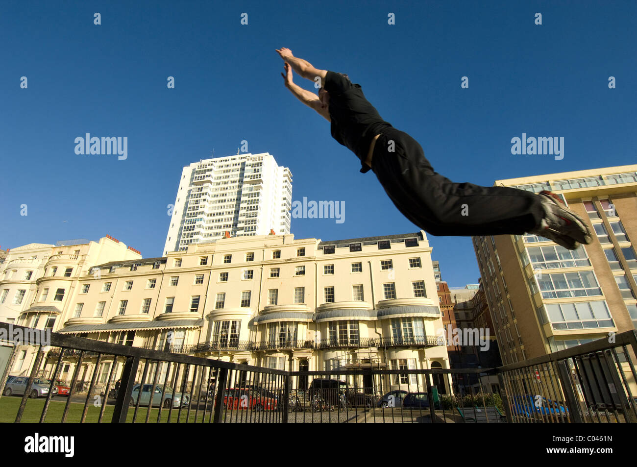 Ben Ockwell practices Parkour, or  FreeRunning, in Regency Square, Brighton, East Sussex, England Britain UK Stock Photo