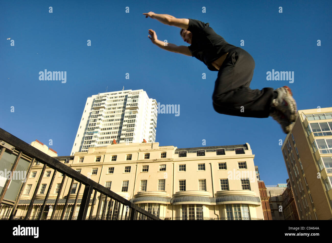 Ben Ockwell practices Parkour, or  FreeRunning, in Regency Square, Brighton, East Sussex, England Britain UK Stock Photo