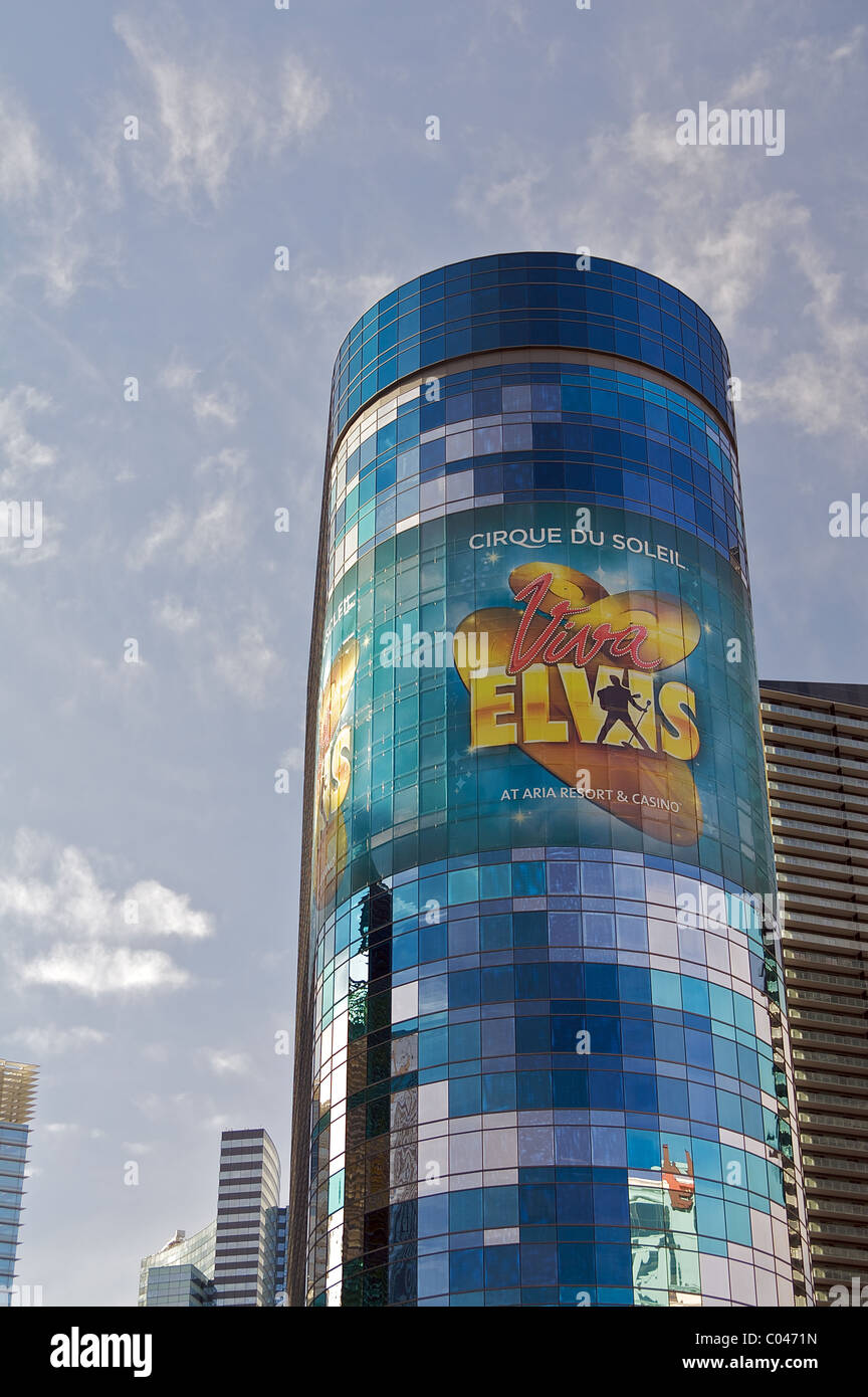 A glass tower with a large advertisement for Cirque du Soleil's 'Viva Elvis' show Stock Photo