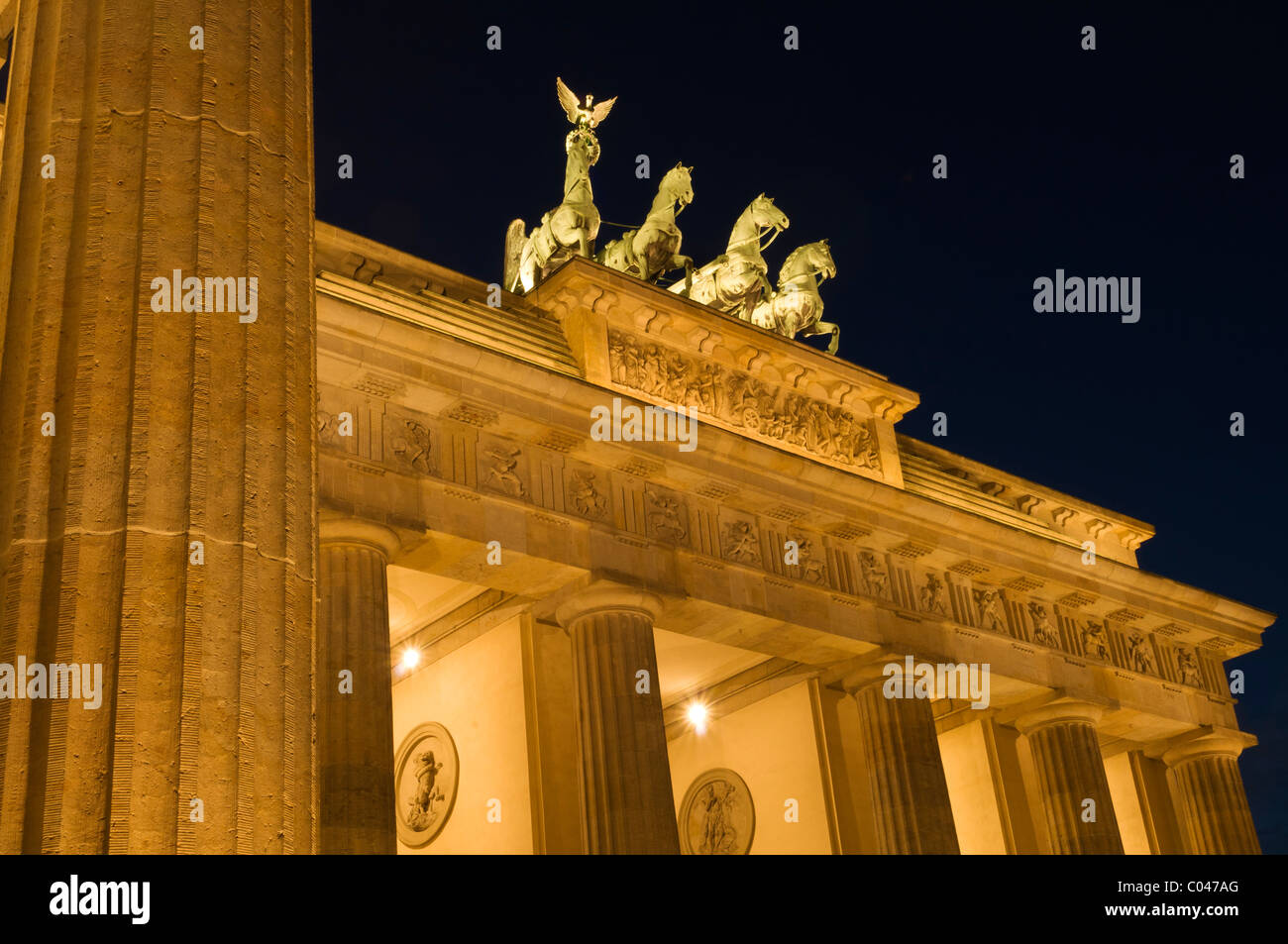 Looking up at the Quadriga by Johann Gottfried Schadow, Brandenberg gate, Berlin at night Stock Photo