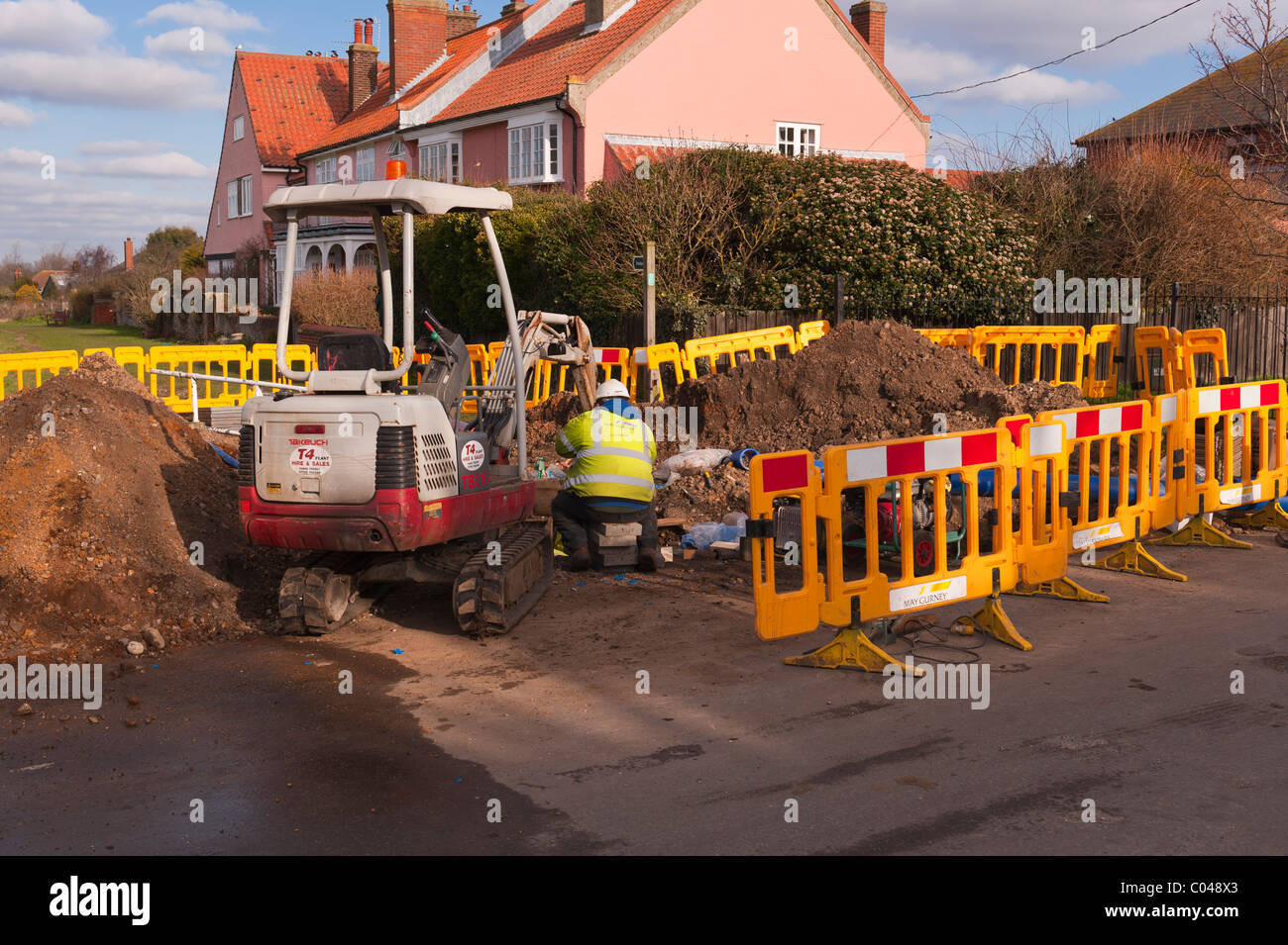 Workmen from May Gurney digging up the road in Southwold , Suffolk