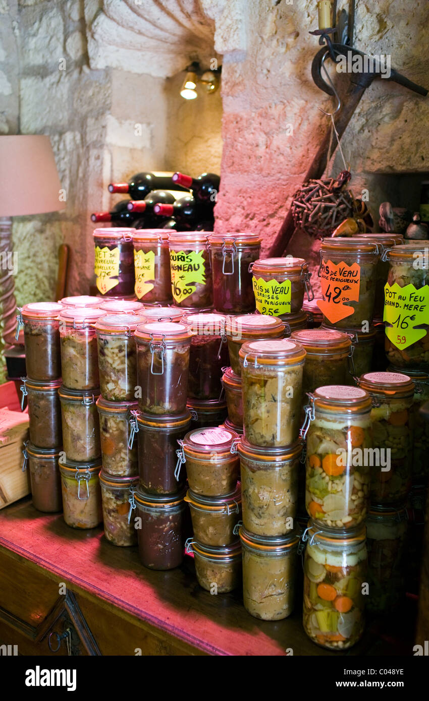 Preserved meats and other foods on sale in Brantome in North Dordogne, France Stock Photo