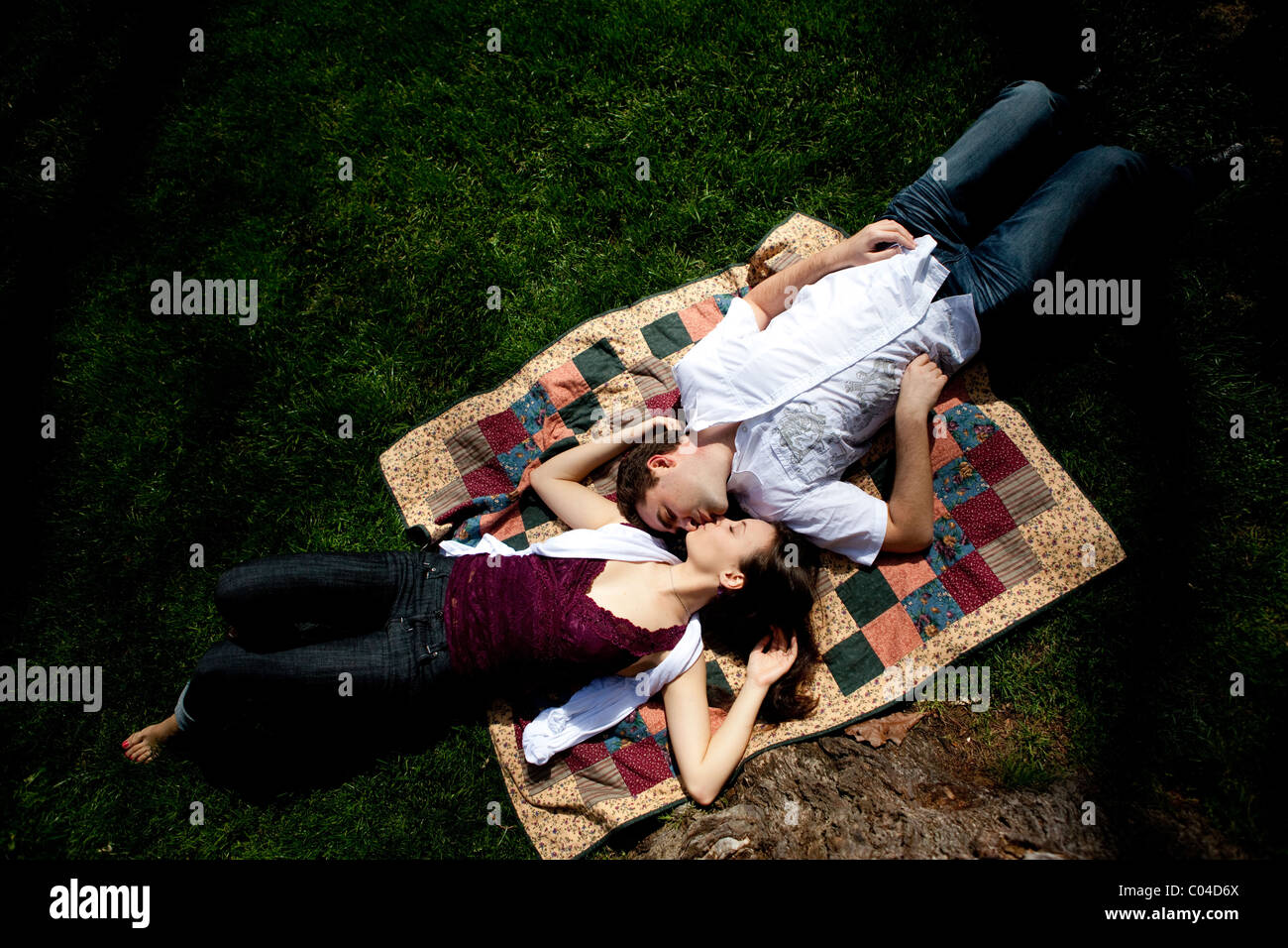 Couple lying down kissing on hi-res stock photography and images - Alamy