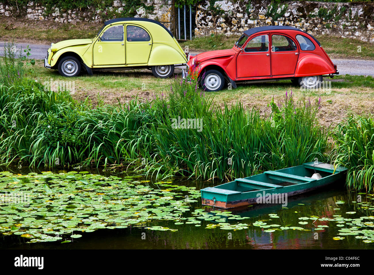 Traditional French Citroen Deux Chevaux 2CV cars at Angles Sur L'Anglin village, Vienne, near Poitiers, France Stock Photo