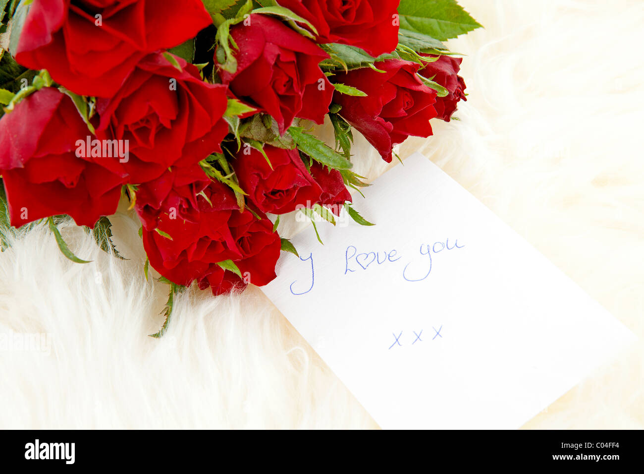 Romantic Notes For Roses Romantic note: I love you with red roses Stock Photo - Alamy