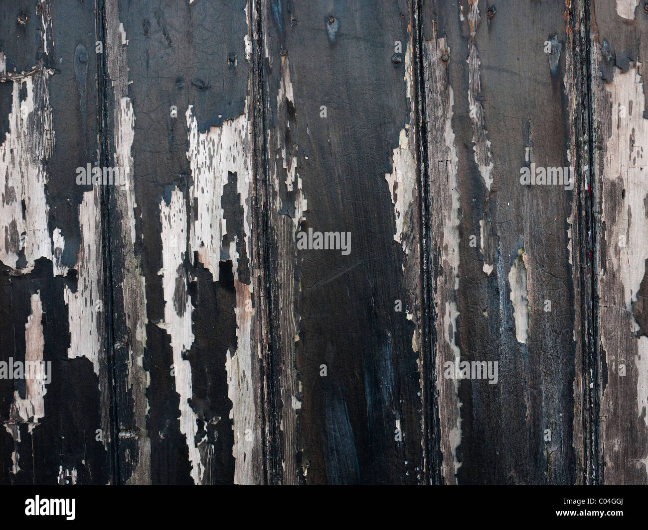 Black paint peeling off a wooden door Stock Photo Alamy