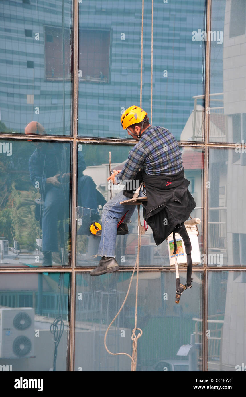 Window washer on side of skyscraper Stock Photo - Alamy