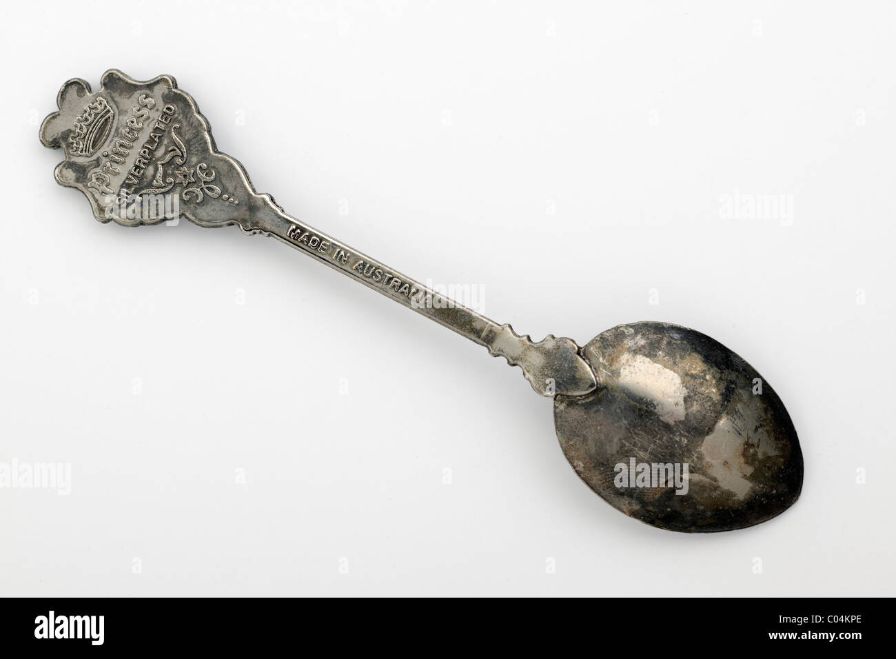 Vintage silverplated discolored sugar spoon showing signs of ageing Stock Photo