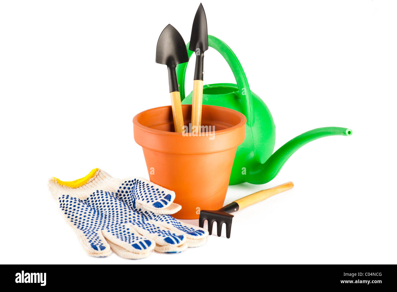 Terracotta flower pot and garden tools on white background Stock Photo