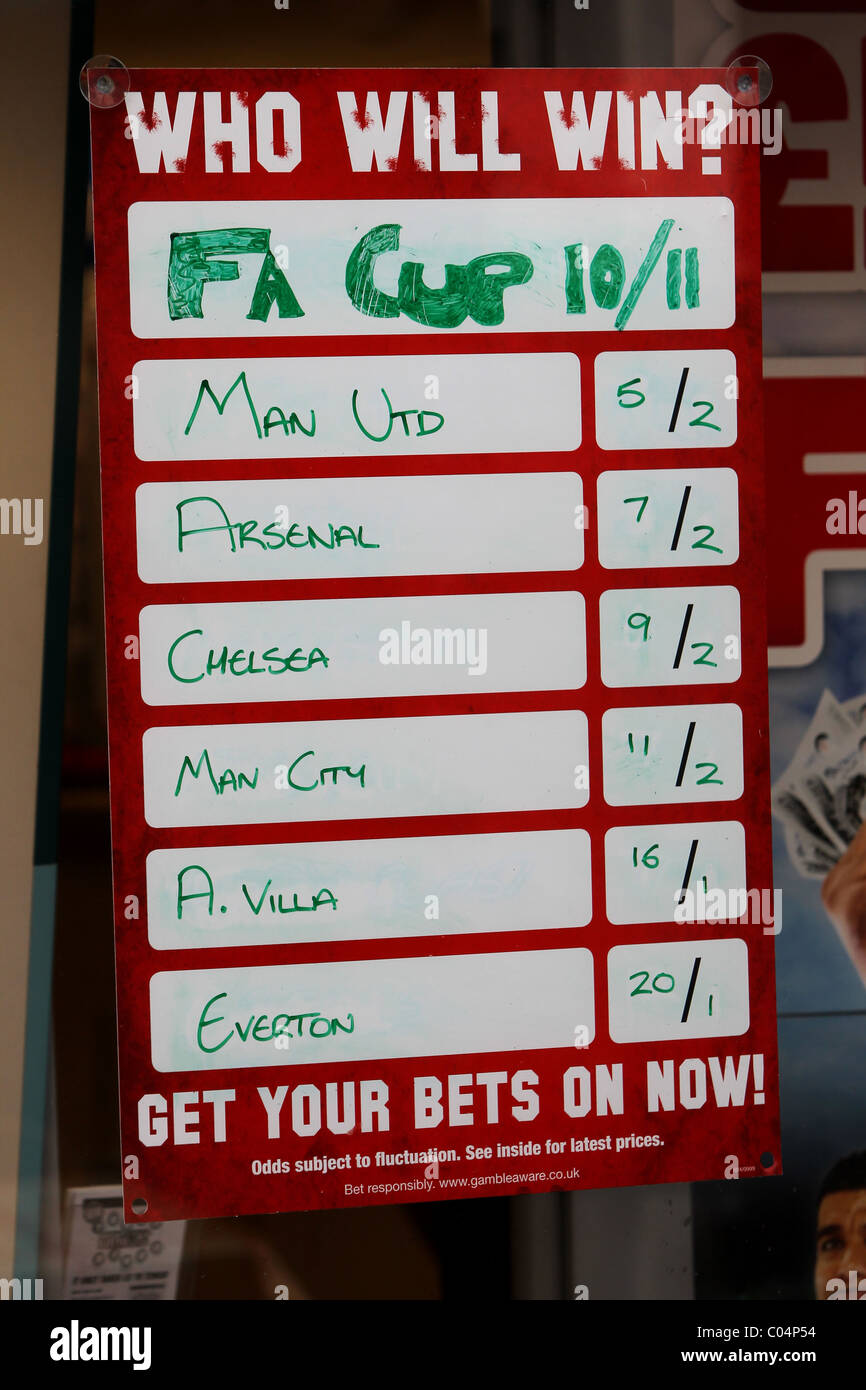 Betting shop window display promoting the odds on football teams to win the FA Cup in Brighton, East Sussex. Stock Photo