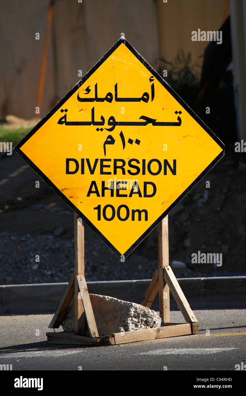 A  road sign announces a diversion ahead in 100m. Stock Photo
