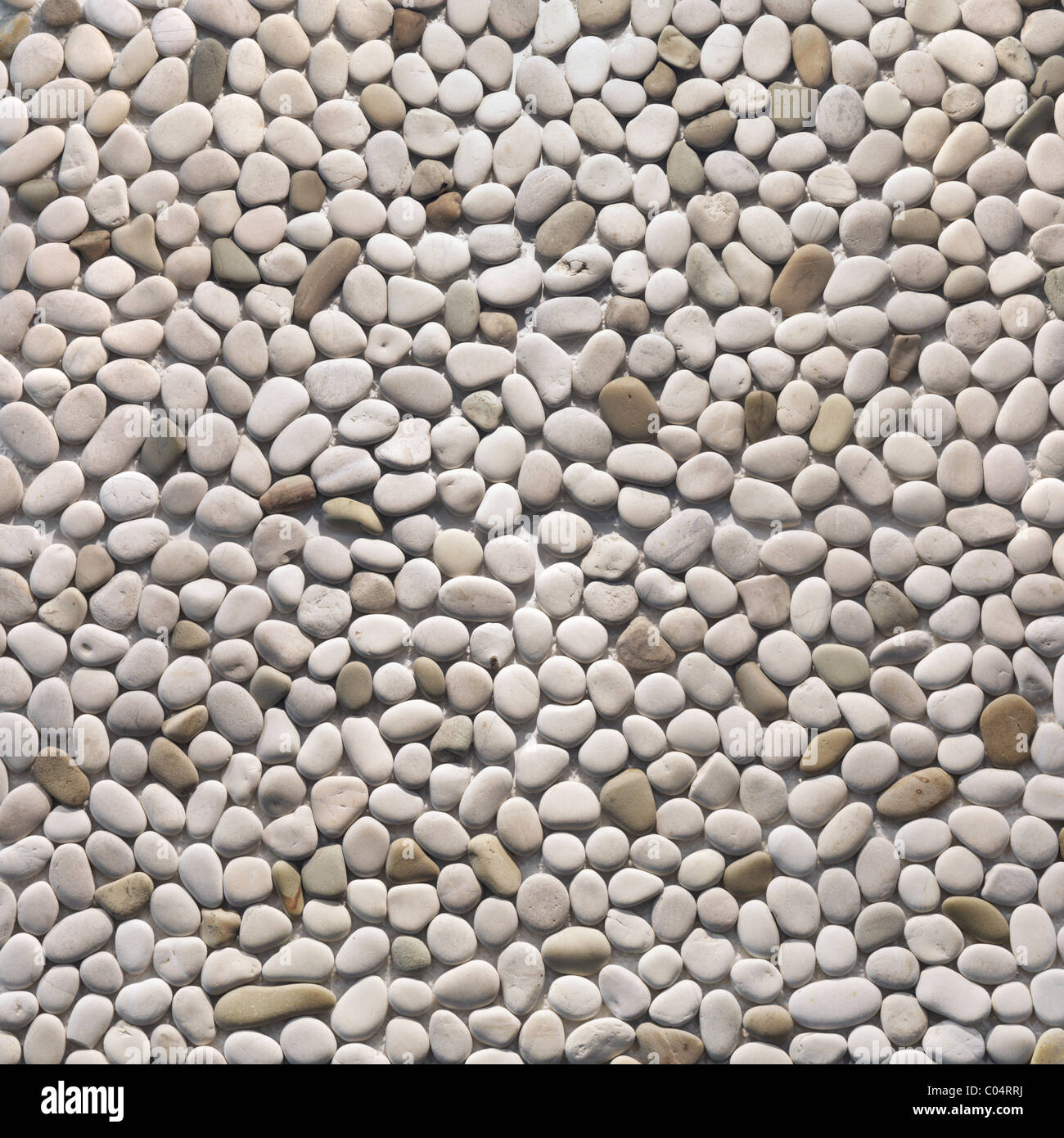 Ivory pebbles texture background. Pebblestone interior and exterior