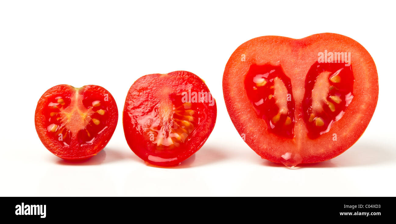 Tomato line up of three different varieties sliced isolated on white. Stock Photo