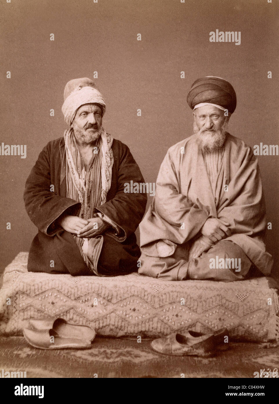 Ottoman Turks in Traditional Clothing and Turbans Praying, Istanbul (Constantinople) Studio Photo. Vintage Albumen Print c1865. Stock Photo