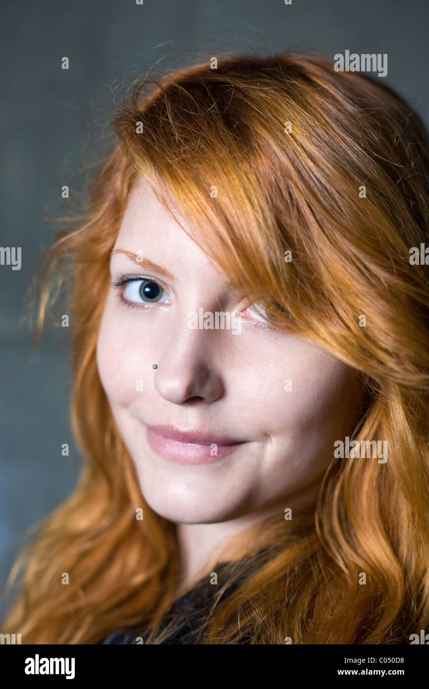 Close-up portrait of a beautiful young redhead girl. Stock Photo