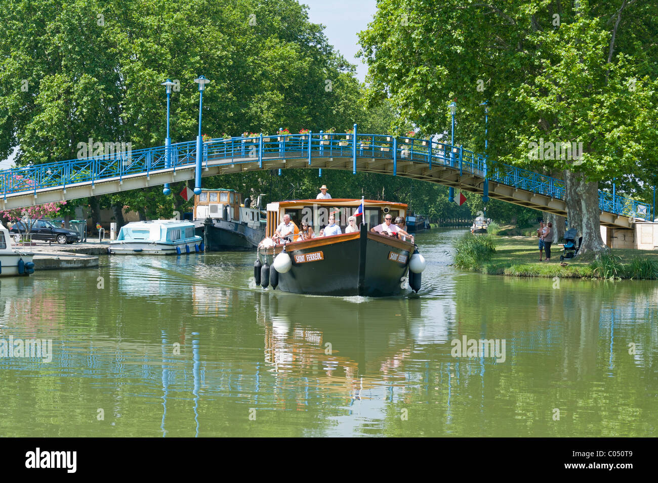 Sightseeing Boat at the French Port of Homps on the Canal du Midi France Stock Photo
