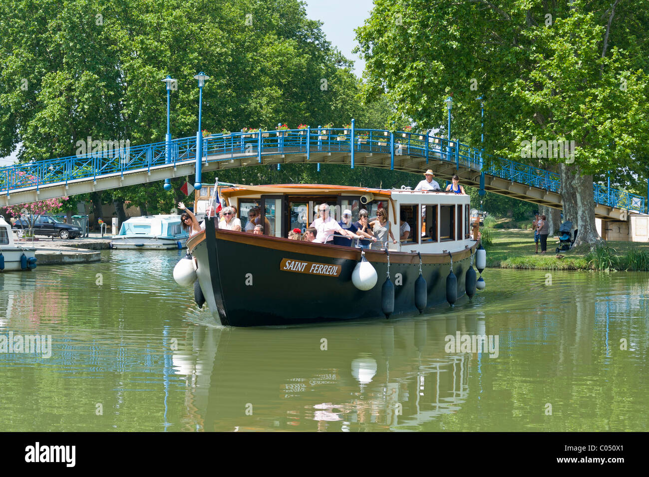 Sightseeing Boat at the French Port of Homps on the Canal du Midi France Stock Photo