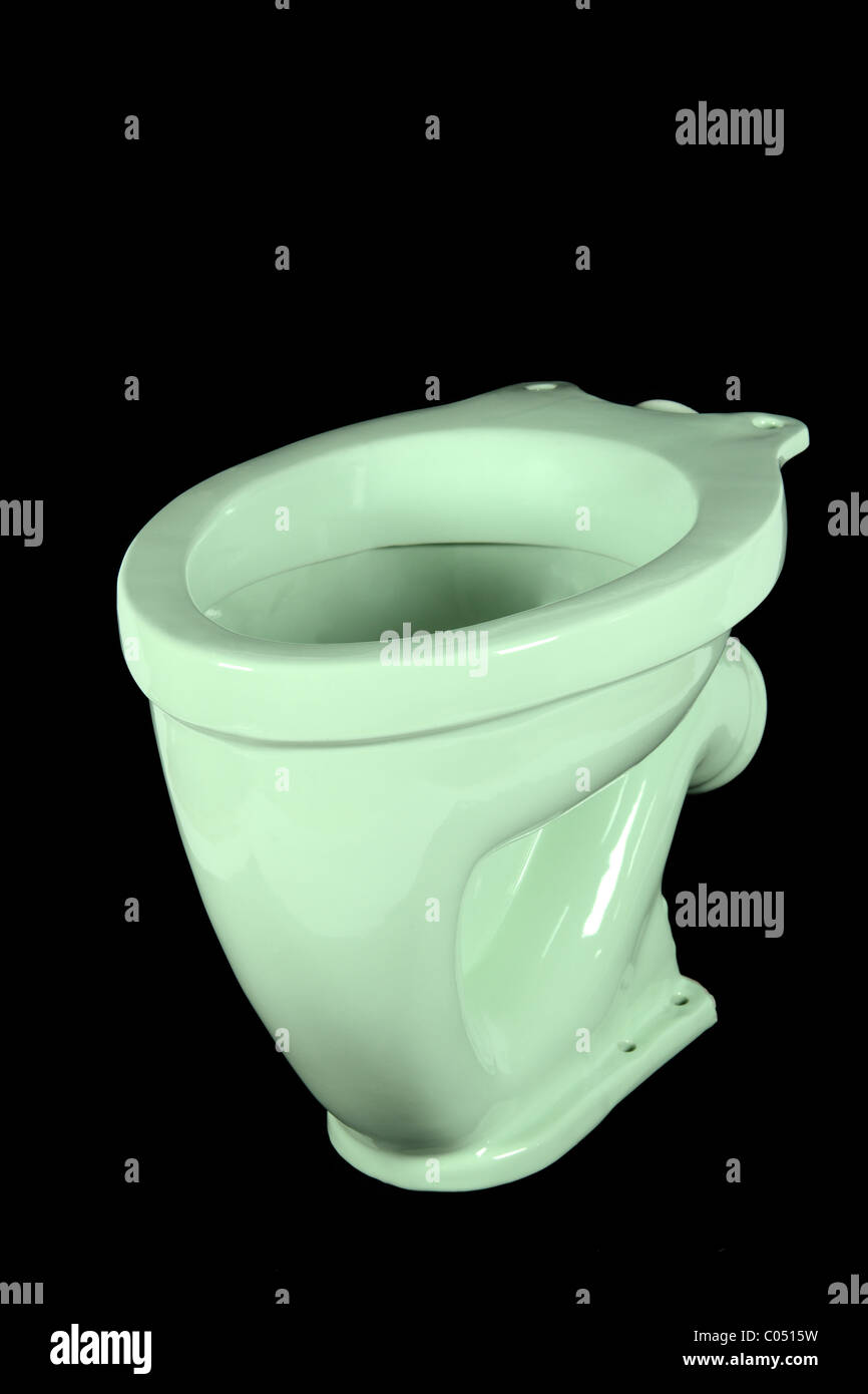 The light green toilet bowl, isolated on black background Stock Photo