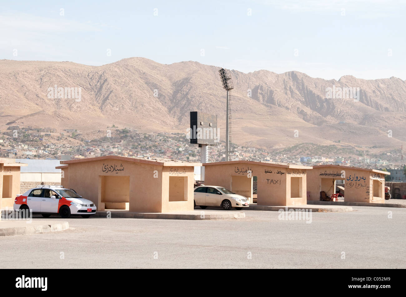 The main intercity taxi station and depot in the Iraqi city of Duhok, in the autonomous Kurdistan region of northern Iraq. Stock Photo