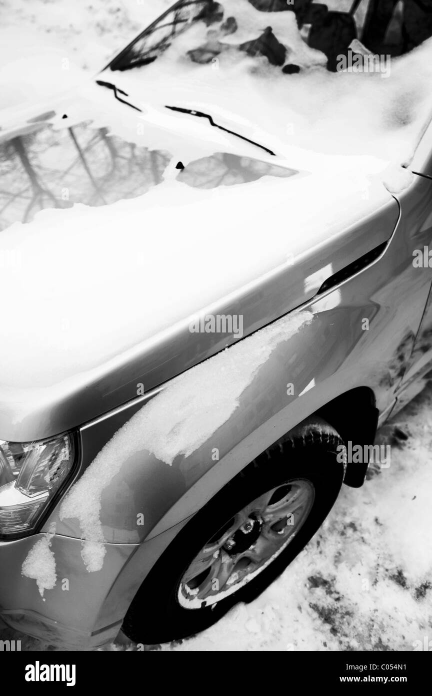 winter in the city - car under snow Stock Photo