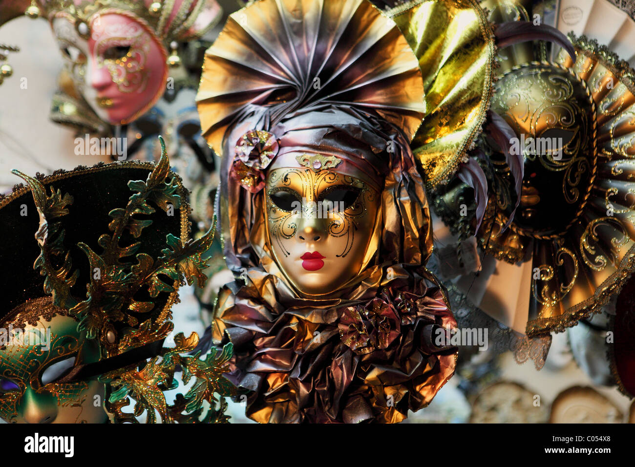 Carnevale masks on sale at a market in Venice, Italy. The masks are popular tourist souvenirs. Stock Photo