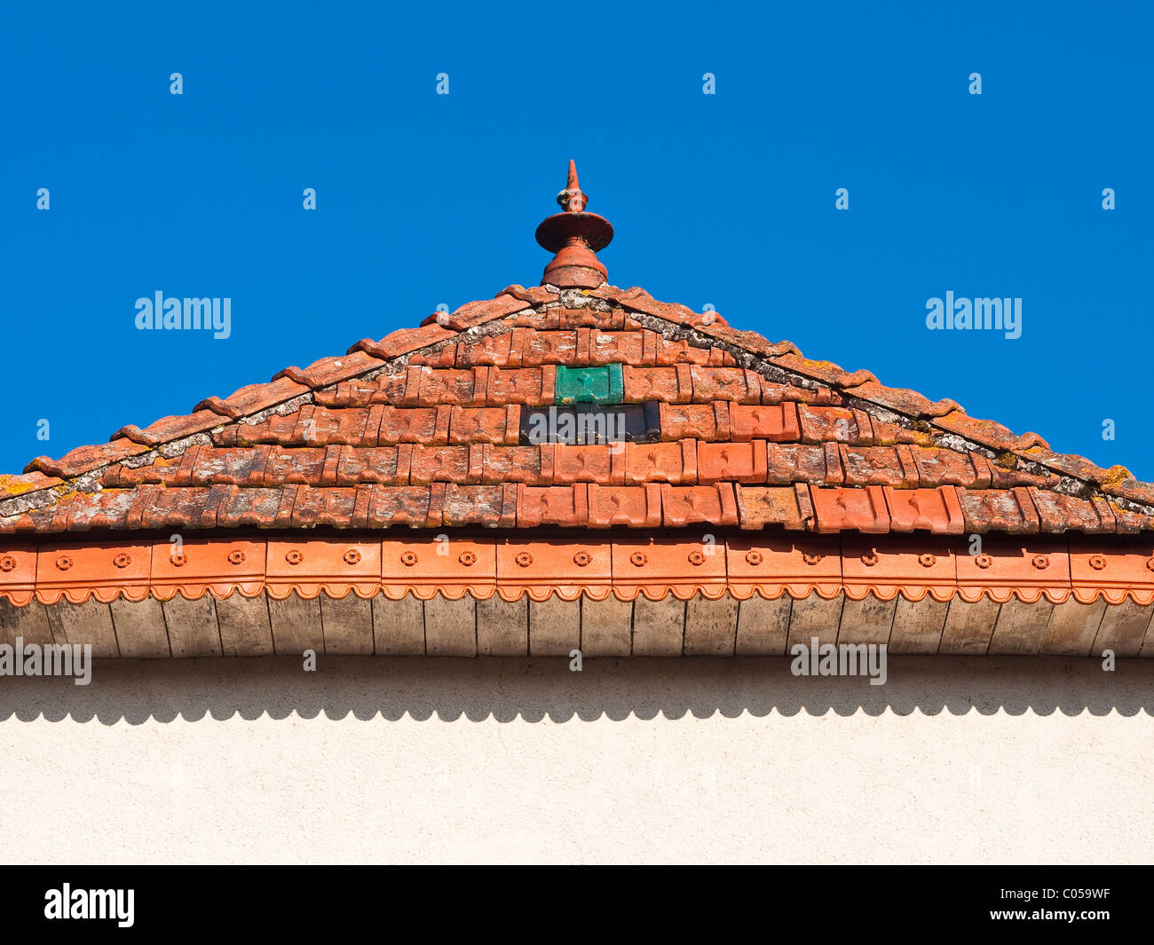 Decorative red clay tiles / roof detail - Indre-et-Loire, France. Stock Photo