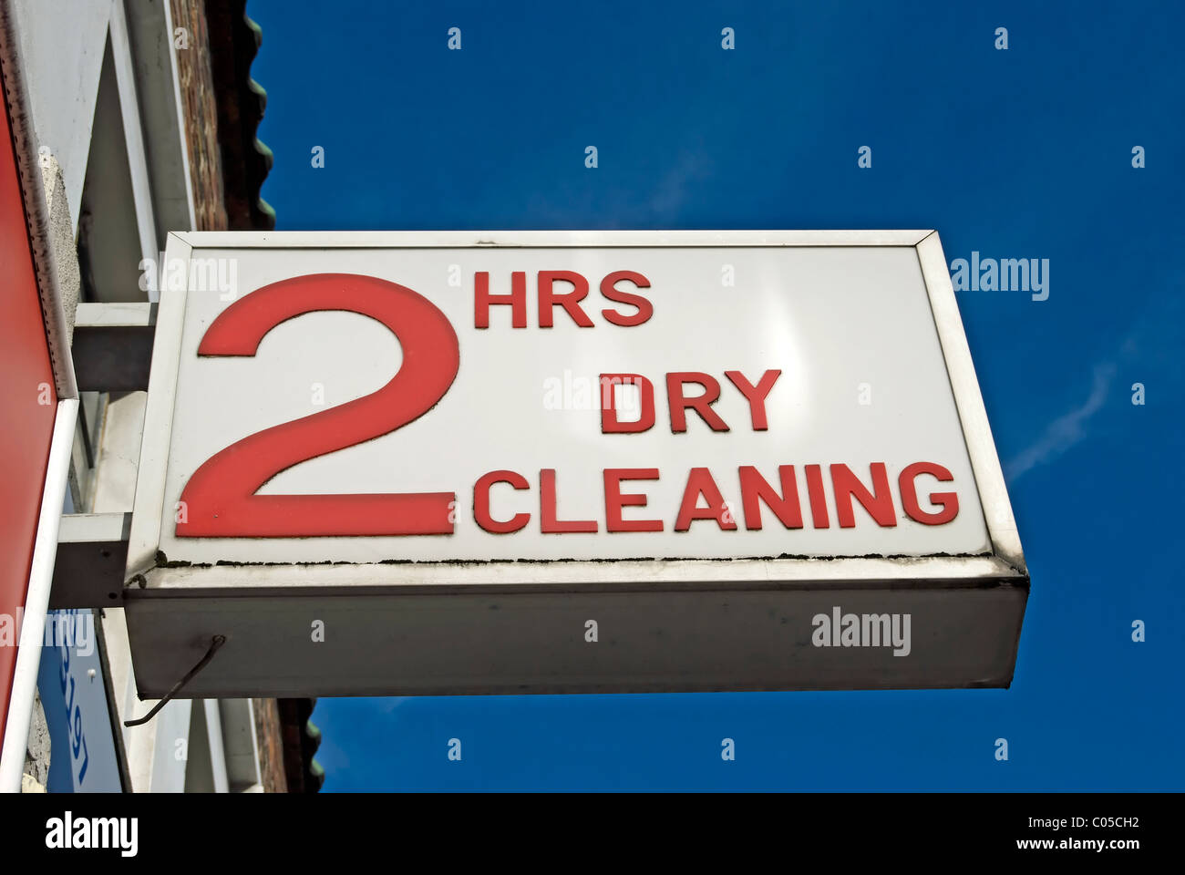 two hour dry cleaning sign outside a shop in new malden, surrey, england Stock Photo