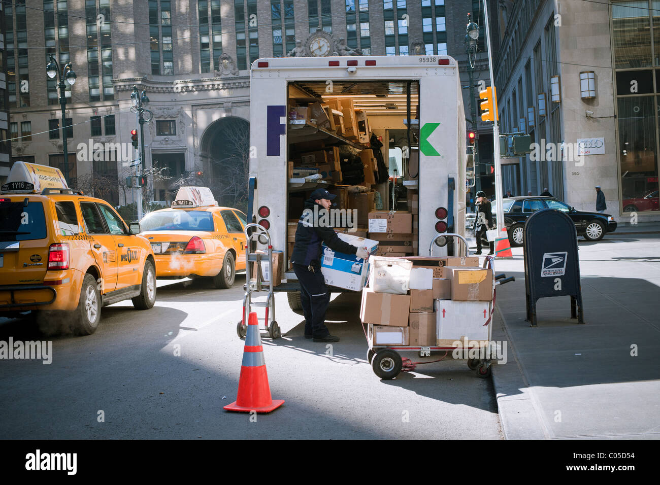 A FedEx employee sorts packages for delivery in Midtown Manhattan in New York Stock Photo