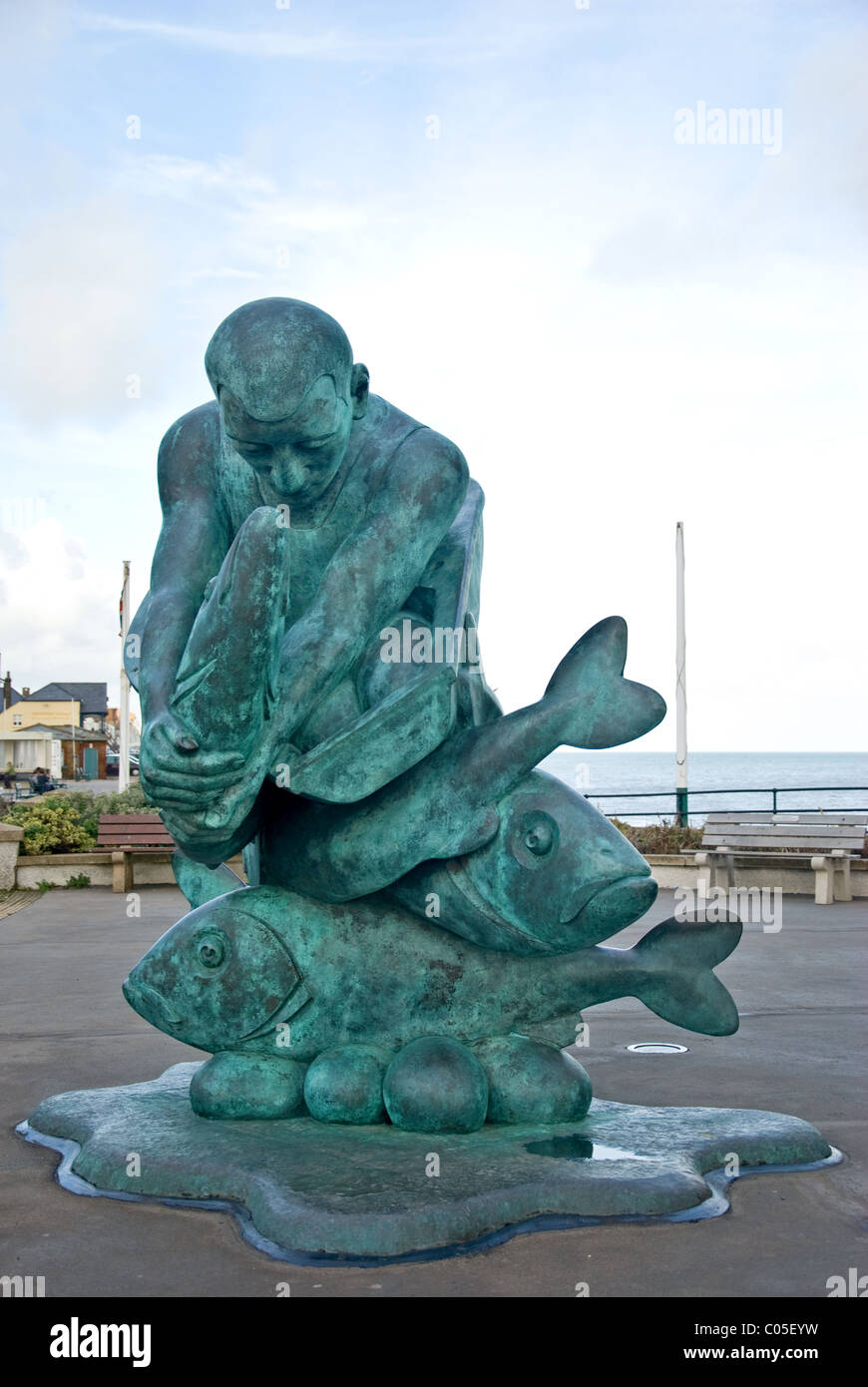 https://c8.alamy.com/comp/C05EYW/metal-statue-of-man-and-fish-C05EYW.jpg