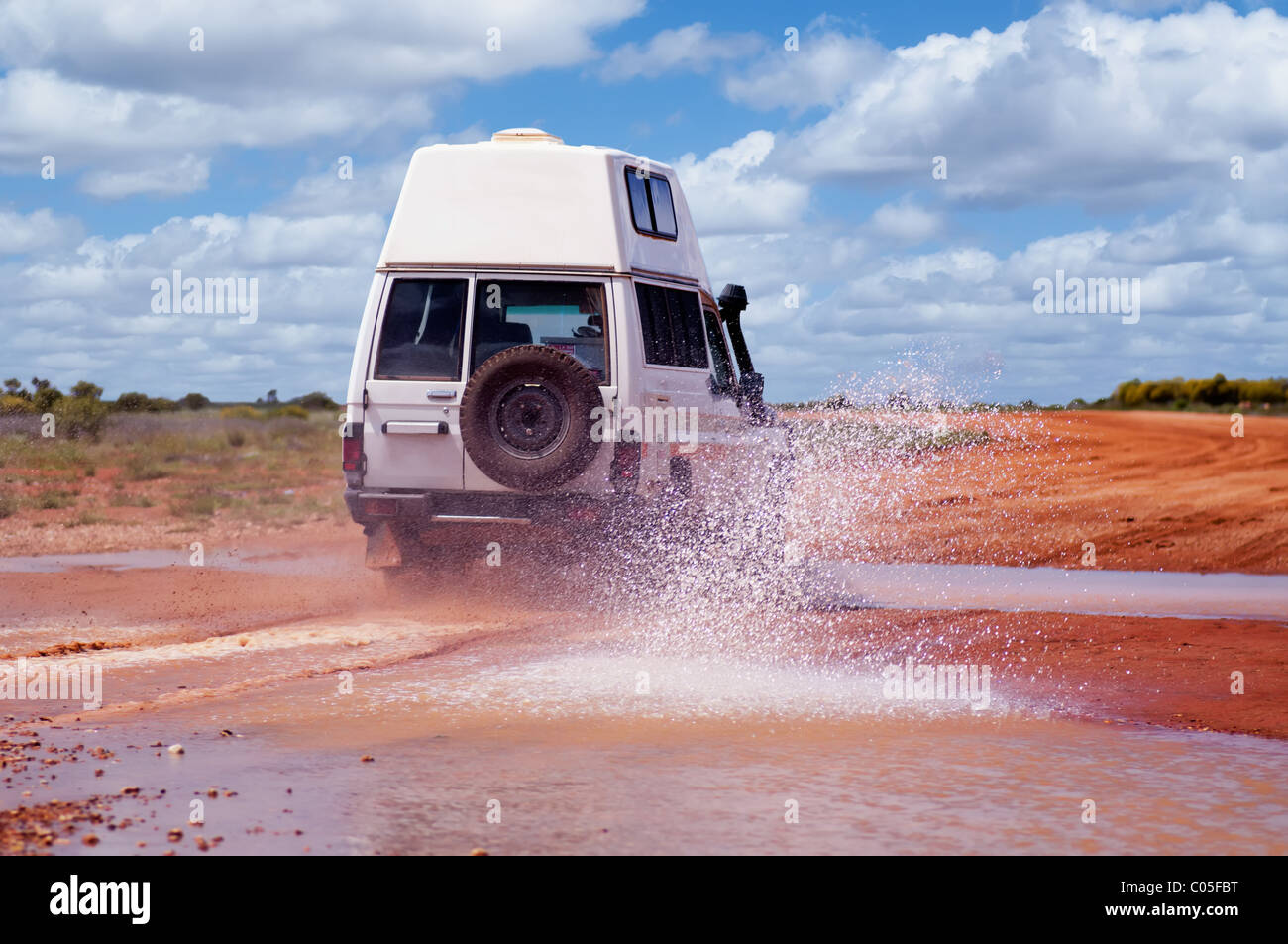 4WD crossing a floodway on an off road track Stock Photo