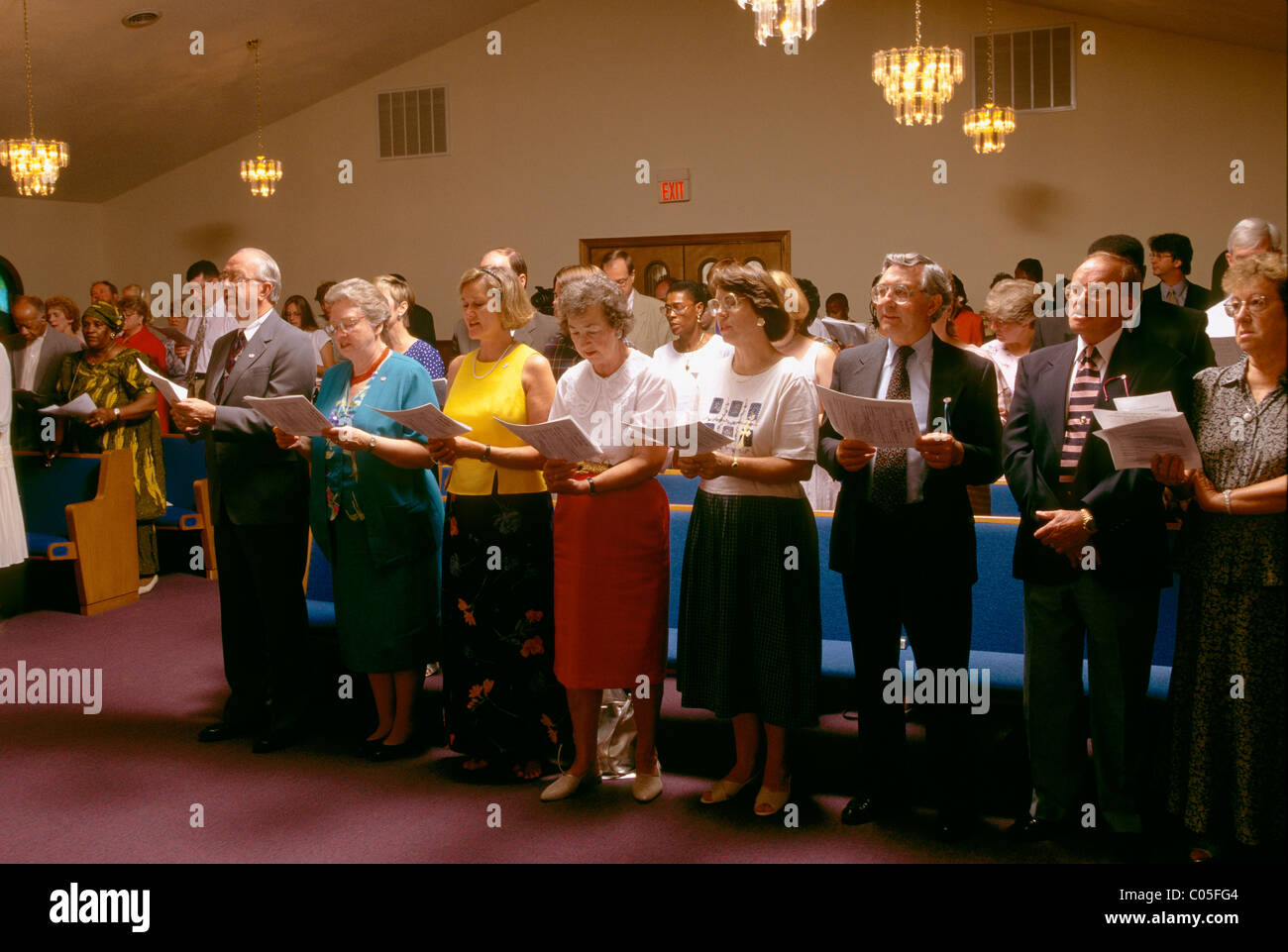 Parishioners singing hymns, church service at Gay's Hill Baptist Church (rebuilt after a fire), Millen, Georgia, USA Stock Photo