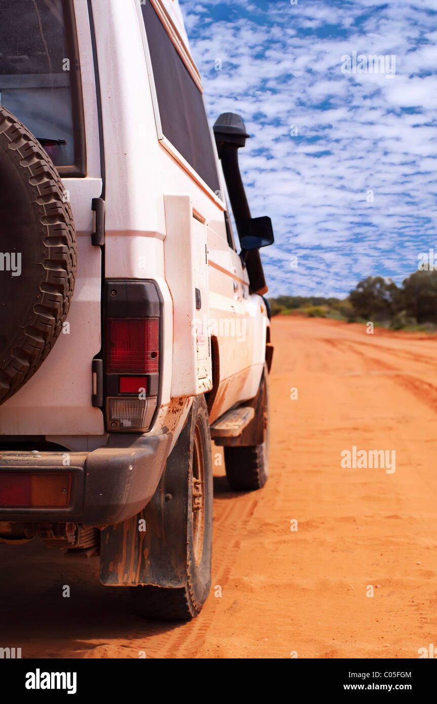 Back view of 4WD on a sandy outback track Stock Photo