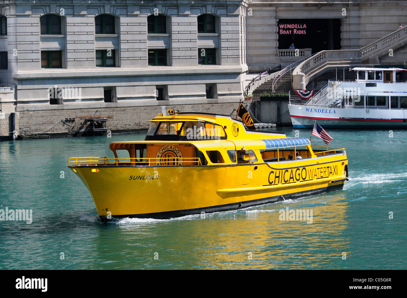 Water taxi cruises down the Chicago River toward the downtown commuter rail stations. Chicago, Illinois, USA. Stock Photo