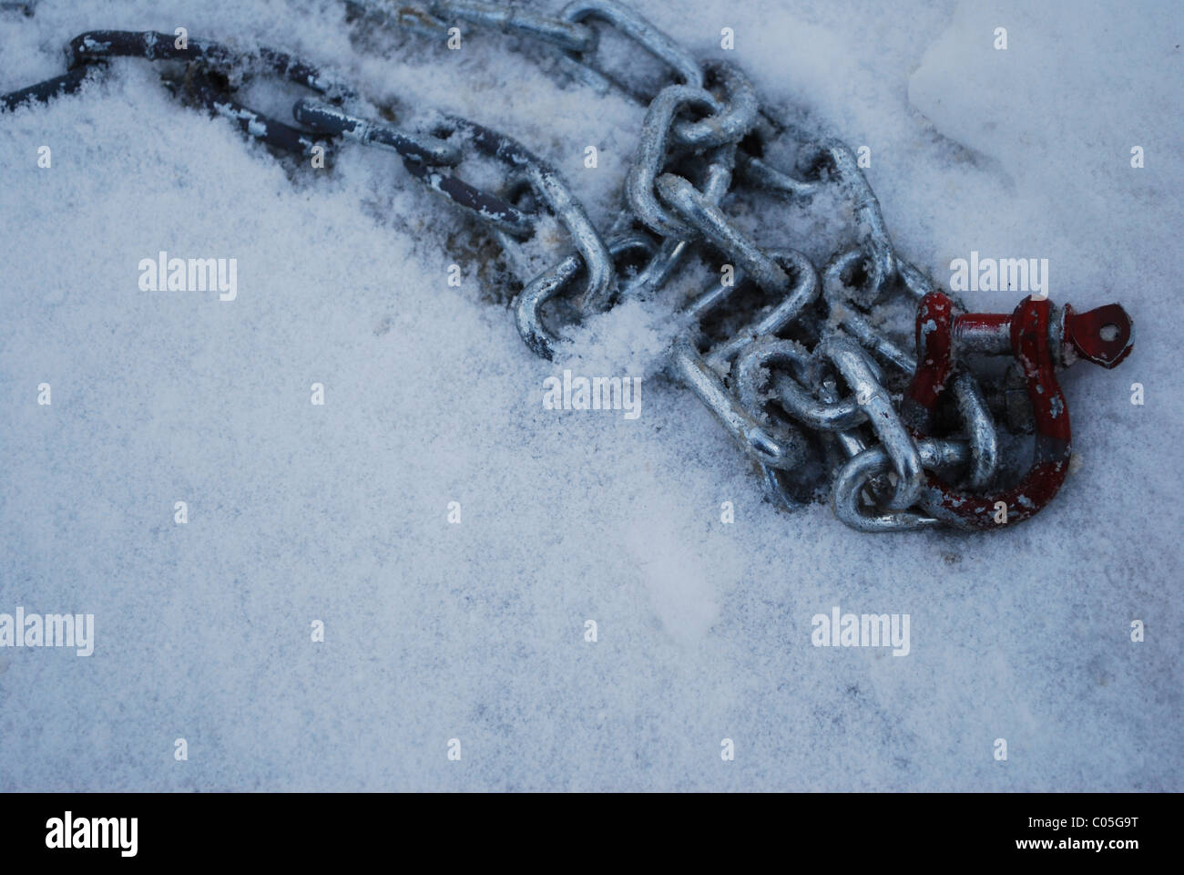 A chain lies in the snow Stock Photo