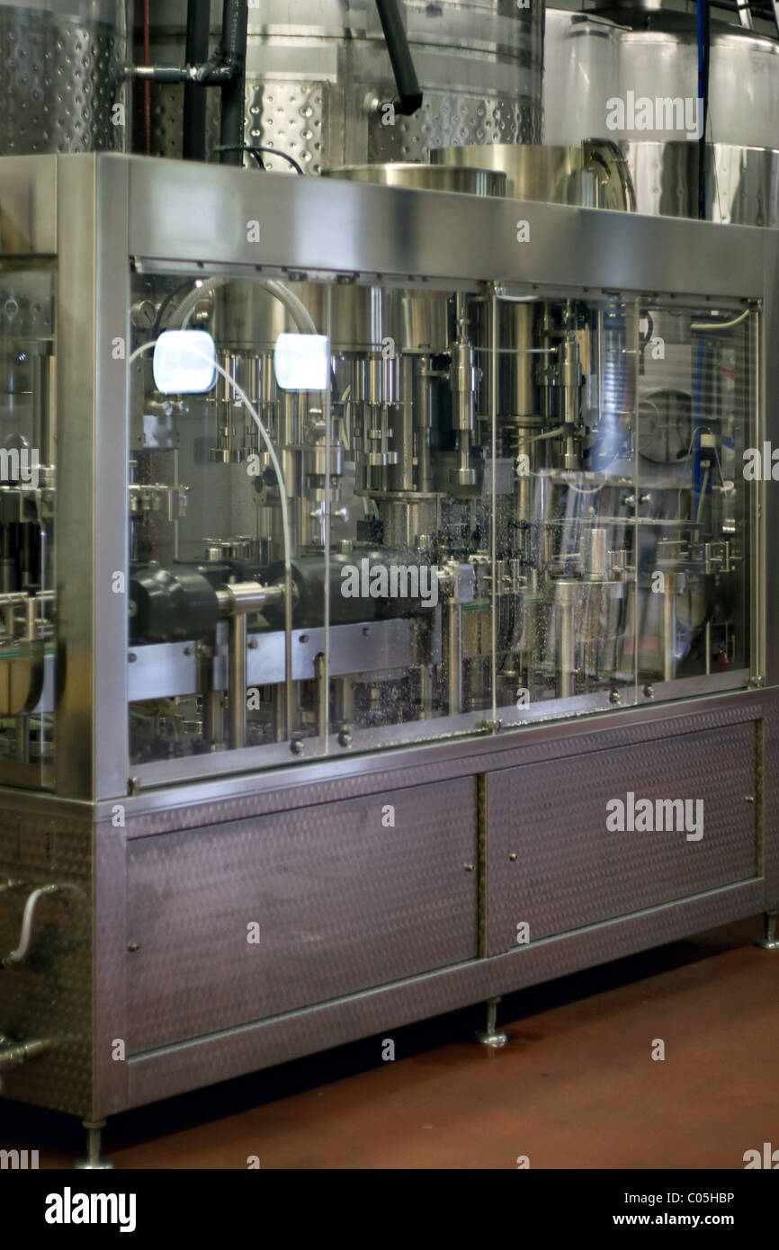 An advanced machine that bottles wine at a winery vineyard plant. Stock Photo