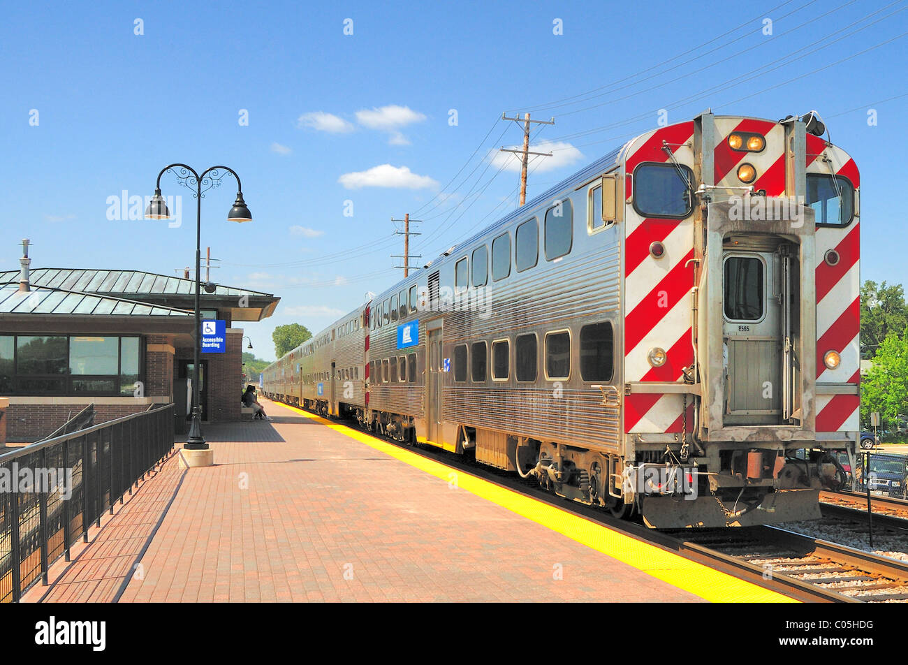 A Metra commuter train arriving at the suburban Chicago station of Bartlett Illinois, USA. Stock Photo
