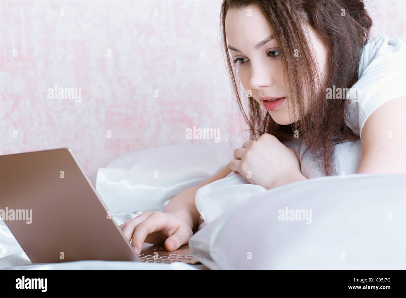 relaxing girl with laptop Stock Photo - Alamy
