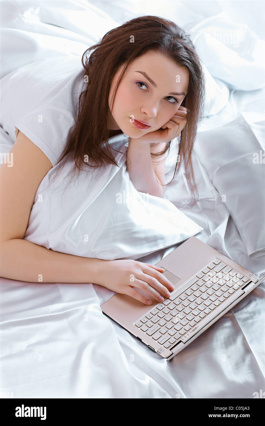 relaxing girl with laptop Stock Photo - Alamy